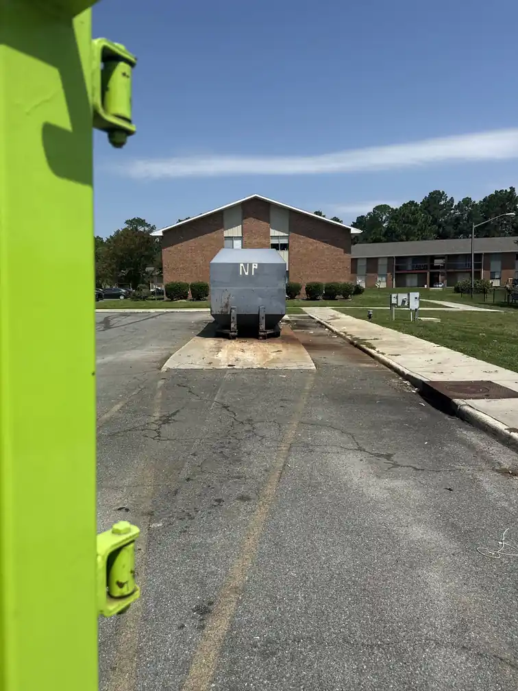 Junk removal equipment and a full lot in Valdosta before a Junk Doctor job