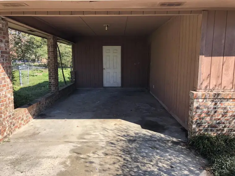 The same carport swept empty and ready to hand back